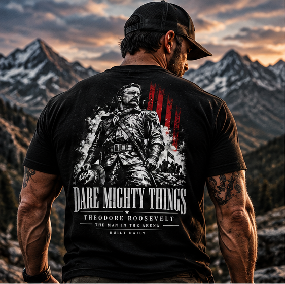 Man in the mountains wearing the Built Daily Roosevelt tee, back view: Theodore Roosevelt in Rough Rider uniform, DARE MIGHTY THINGS