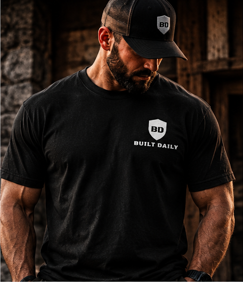 Man wearing the Built Daily Roosevelt tee, front view with the small shield and BUILT DAILY on the chest
