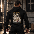 Man in a gym wearing the Built Daily King Baldwin hoodie, back view: BE STRONG AND COURAGEOUS